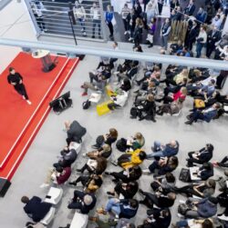 Audience in front of and next to the Yellow Stage at EuroShop