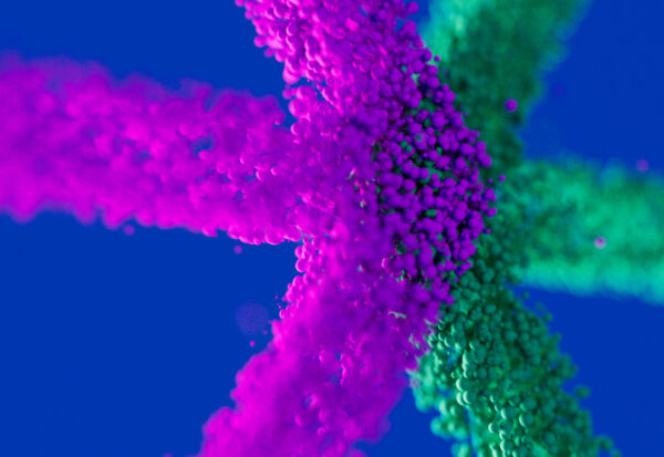 Abstrakte Darstellung mit pinken und grünen Partikeln, die sich sternförmig auf blauem Hintergrund ausbreiten; copyright: Messe Düsseldorf